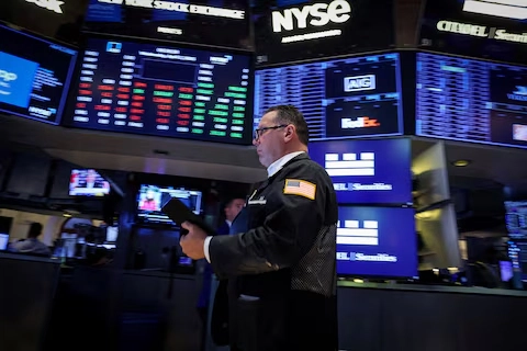 n the NYSE trading floor, a broker actively handles transactions